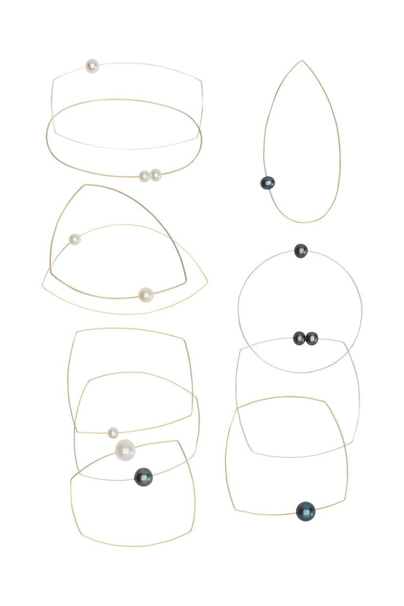Oval Bangle with hand-cut precious gemstones